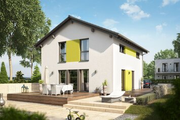 FingerHaus MEDLEY 200 – modernes zweigeschossiges Einfamilienhaus mit Satteldach, weißer Putzfassade und gelben Fassadenelementen. Im Vordergrund eine große Holzterrasse mit Esstisch und Liege, umgeben von Garten, Rasen und Pflanzbeeten.