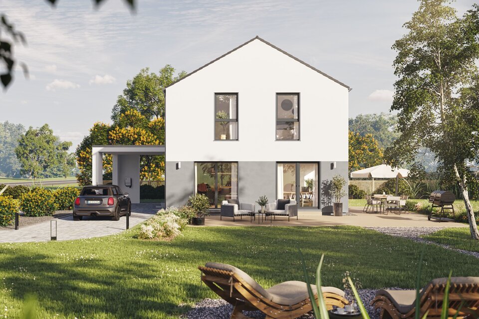 Fertighaus FingerHaus LIV 201 mit heller Fassade, Satteldach und Terrasse im sonnigen Garten mit Liegestühlen, Rasen und Pflanzen.