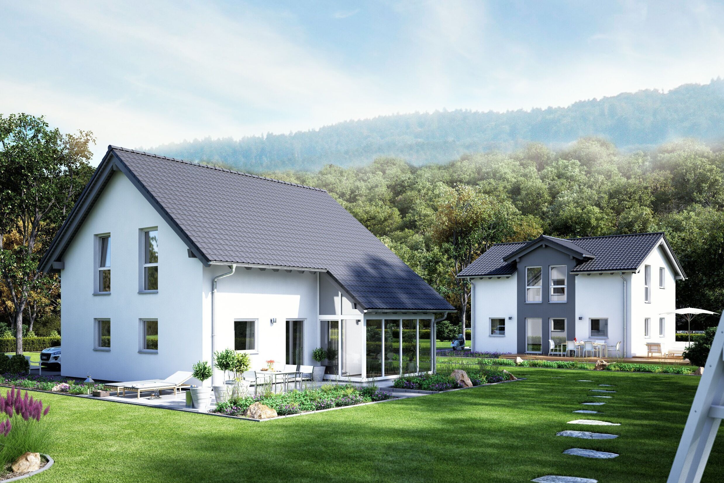 FingerHaus UNO 2.0 – Einfamilienhaus mit Satteldach, heller Fassade und großen Fenstern. Mehrere Häuser sind in einer offenen Gartenlandschaft mit Rasen, Wegen und Bäumen angeordnet.