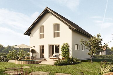 FingerHaus TALO 211 – Einfamilienhaus mit Satteldach, heller Fassade und großen Fenstern. Der Garten zeigt Natursteinplatten, Rasenfläche und blühende Pflanzen.
