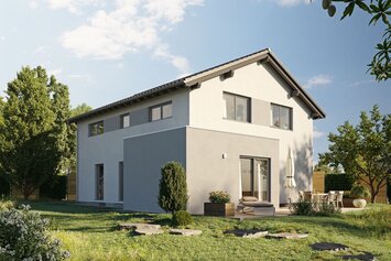 FingerHaus LUMIS 170 – zweigeschossiges Einfamilienhaus mit Satteldach, heller Putzfassade und großen Fenstern. Im Garten befinden sich Rasen, Sitzbereich mit Sesseln und Steinplatten.