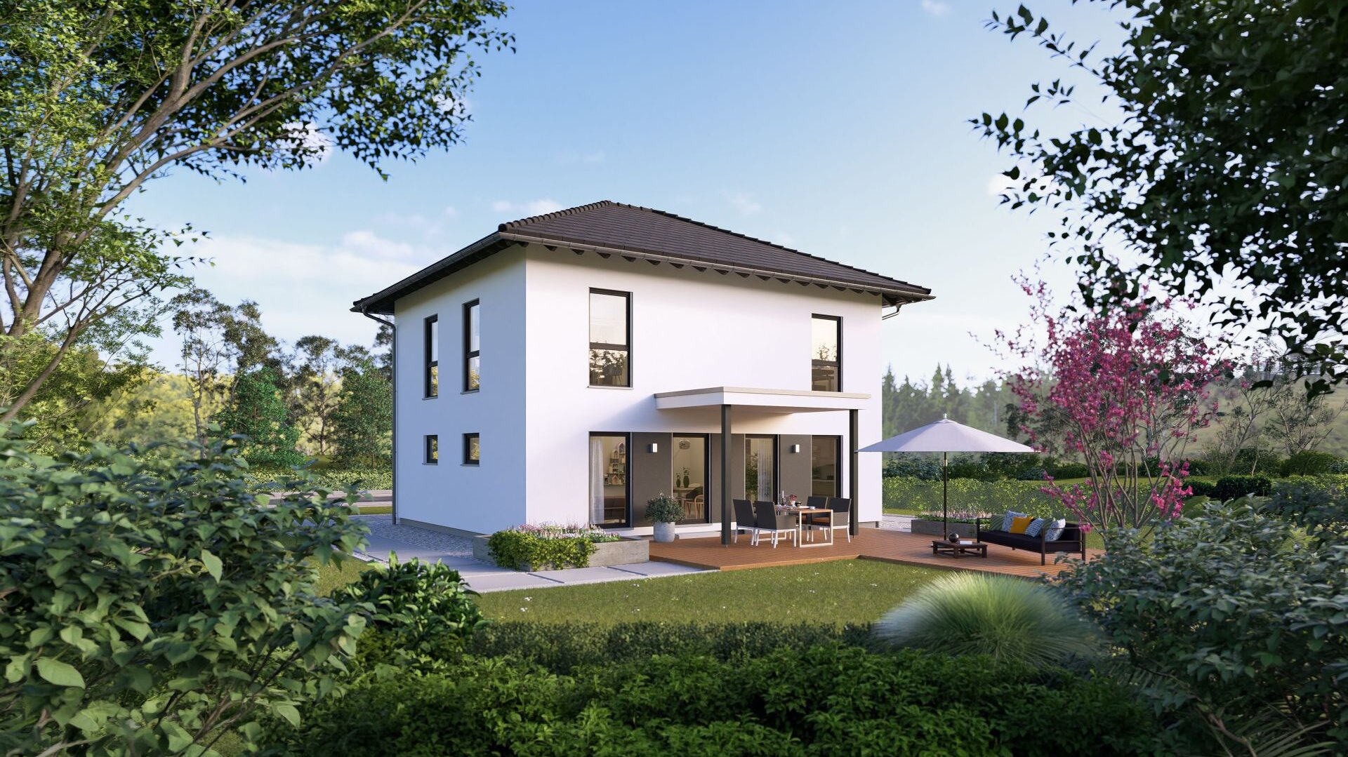 Modernes zweigeschossiges FingerHaus Fertighaus mit Flachdach und großer Terrasse in naturnaher Gartenlandschaft