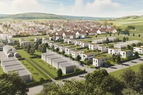 Luftaufnahme eines modernen FingerHaus Baugebiet "Leben in Fulda" mit Reihenhäusern und Einfamilienhäusern in einer grünen Landschaft mit Hügeln im Hintergrund