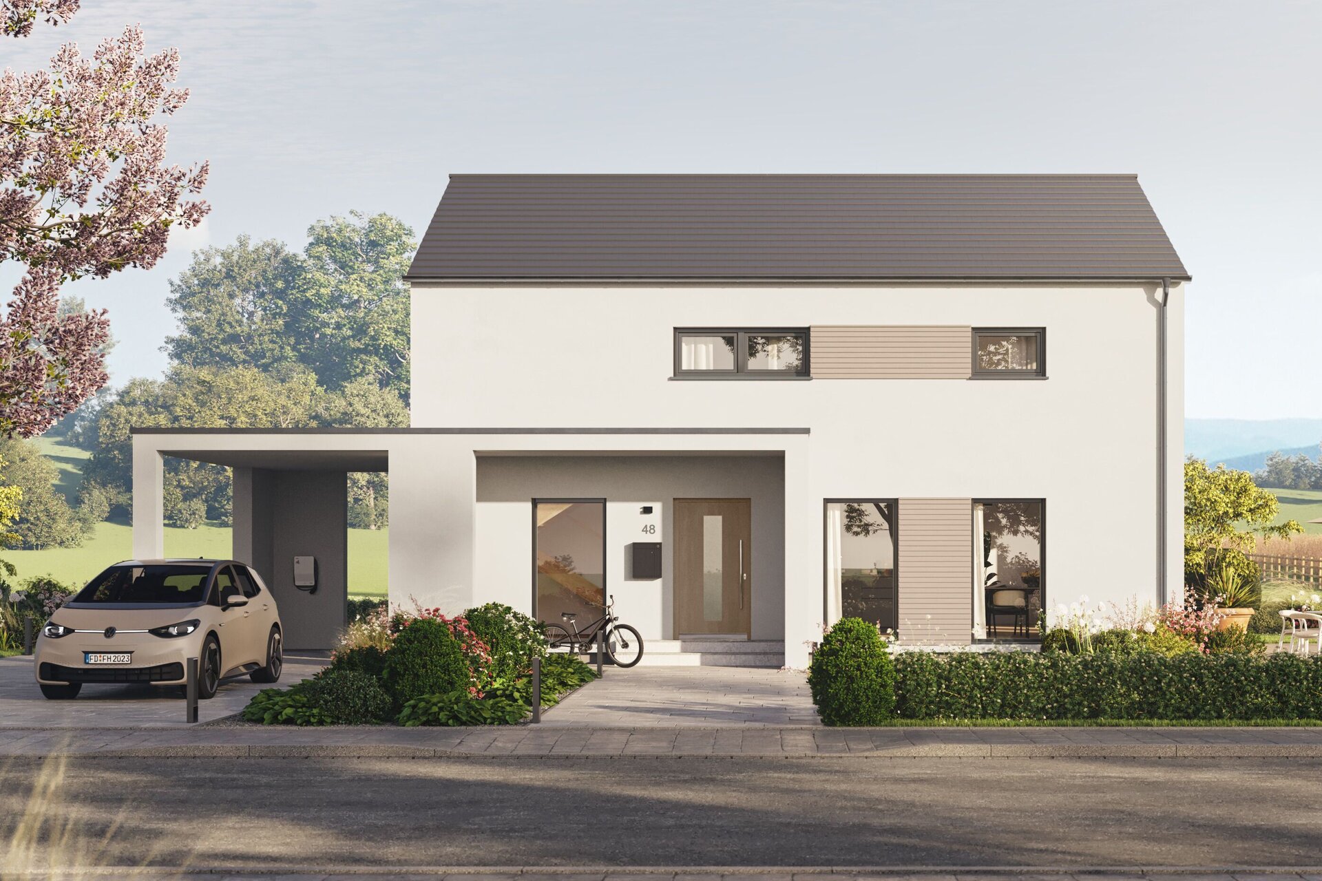 Fertighaus FingerHaus LIV 200 mit heller Fassade, Flachdach und Vorgarten mit bunten Blumen, Büschen und gepflasterter Zufahrt.