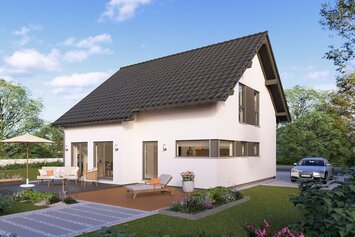 Modernes FingerHaus Fertighaus mit Satteldach, großen Fenstern und Terrasse mit Gartenmöbeln in grüner Umgebung