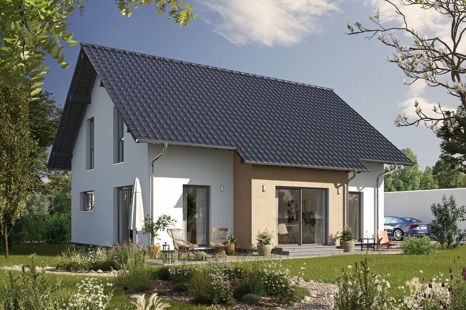 Fertighaus FingerHaus JUNO 200 mit heller Fassade, dunklem Satteldach und Gartenweg aus Kies, umgeben von blühenden Pflanzen und Rasen im Sonnenschein.