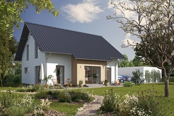 Fertighaus FingerHaus JUNO 200 mit heller Fassade, dunklem Satteldach und Gartenweg aus Kies, umgeben von blühenden Pflanzen und Rasen im Sonnenschein.
