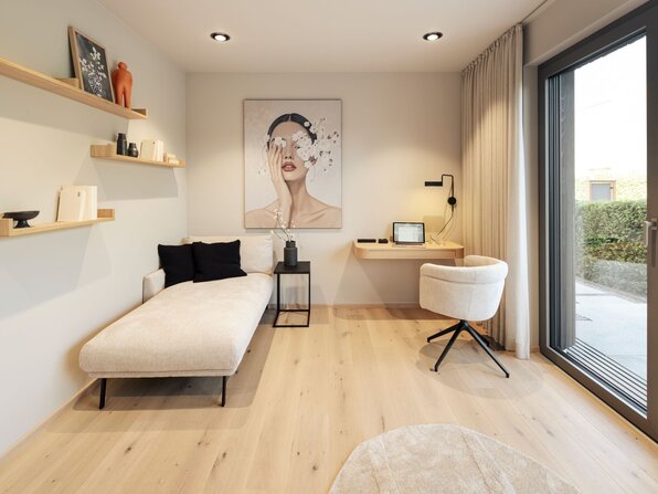 Gästezimmer im FingerHaus Musterhaus NIVO in Frankenberg mit Schlafsofa, Schreibtisch, Sessel und großer Terrassentür.